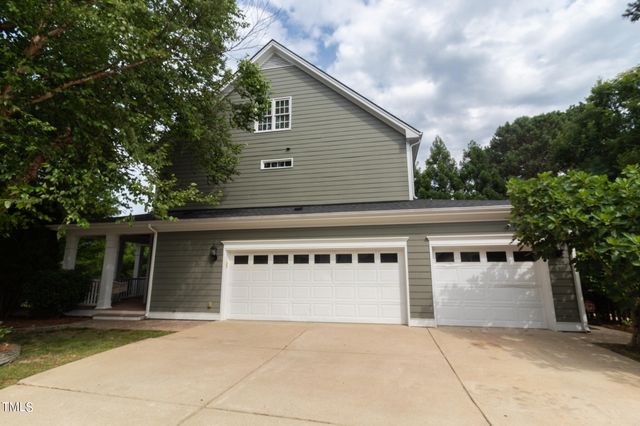 a view of house with trees in front of it