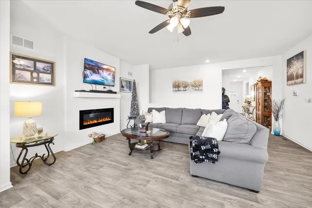 a living room with furniture and a fireplace