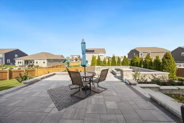 a view of swimming pool with outdoor seating and a tub