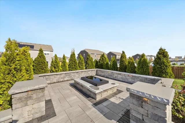 a view of a house with a yard and a garden