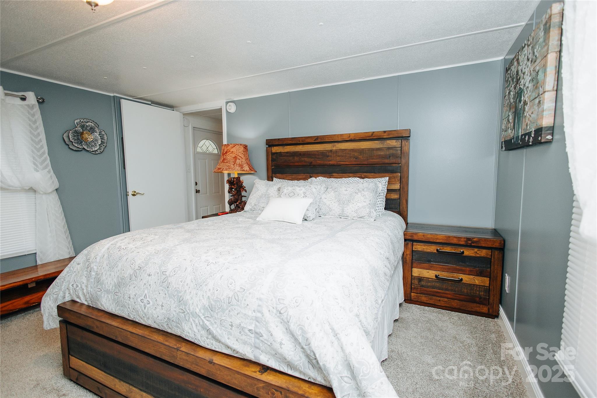 325 Griggs Road Old Fort, NC 28762 - Photo 14 of 36 a bedroom with a bed and a window