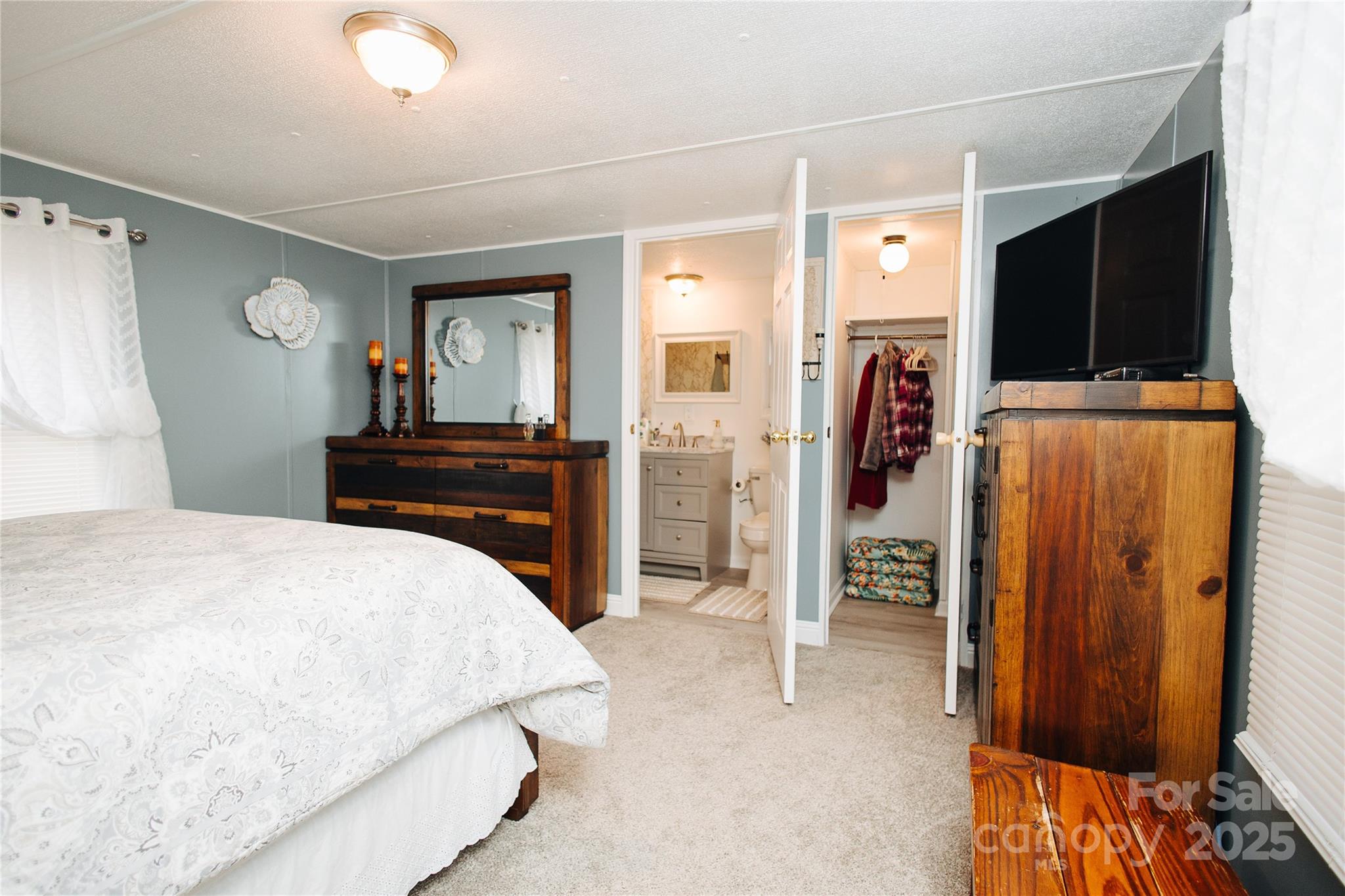 325 Griggs Road Old Fort, NC 28762 - Photo 16 of 36 a bedroom with a bed and a bathroom