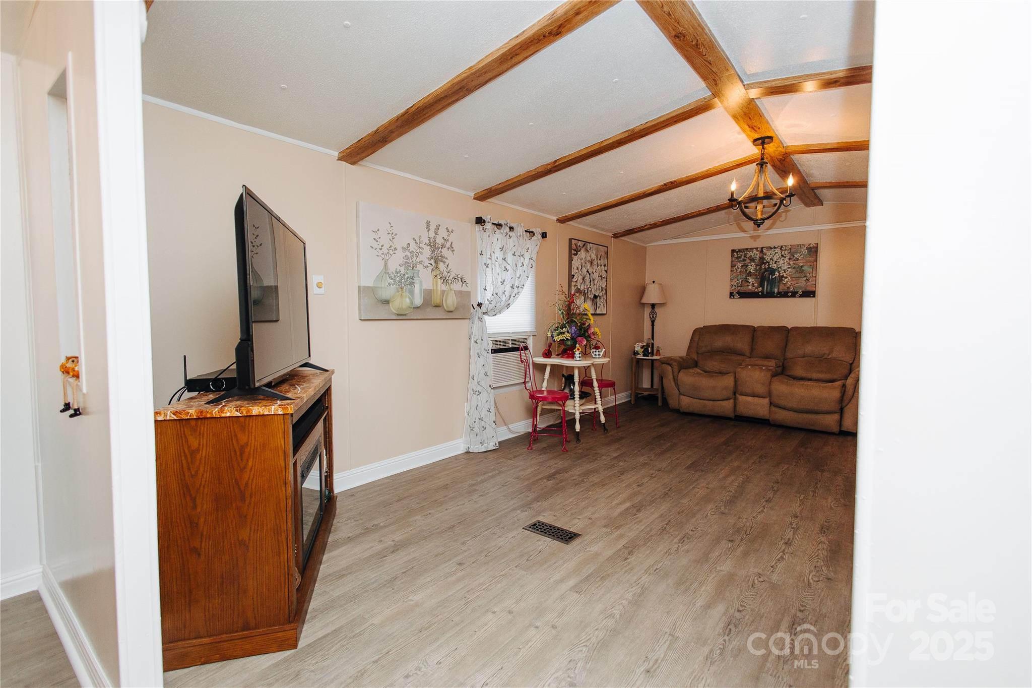 325 Griggs Road Old Fort, NC 28762 - Photo 23 of 36 a view of a livingroom with furniture and a flat screen tv
