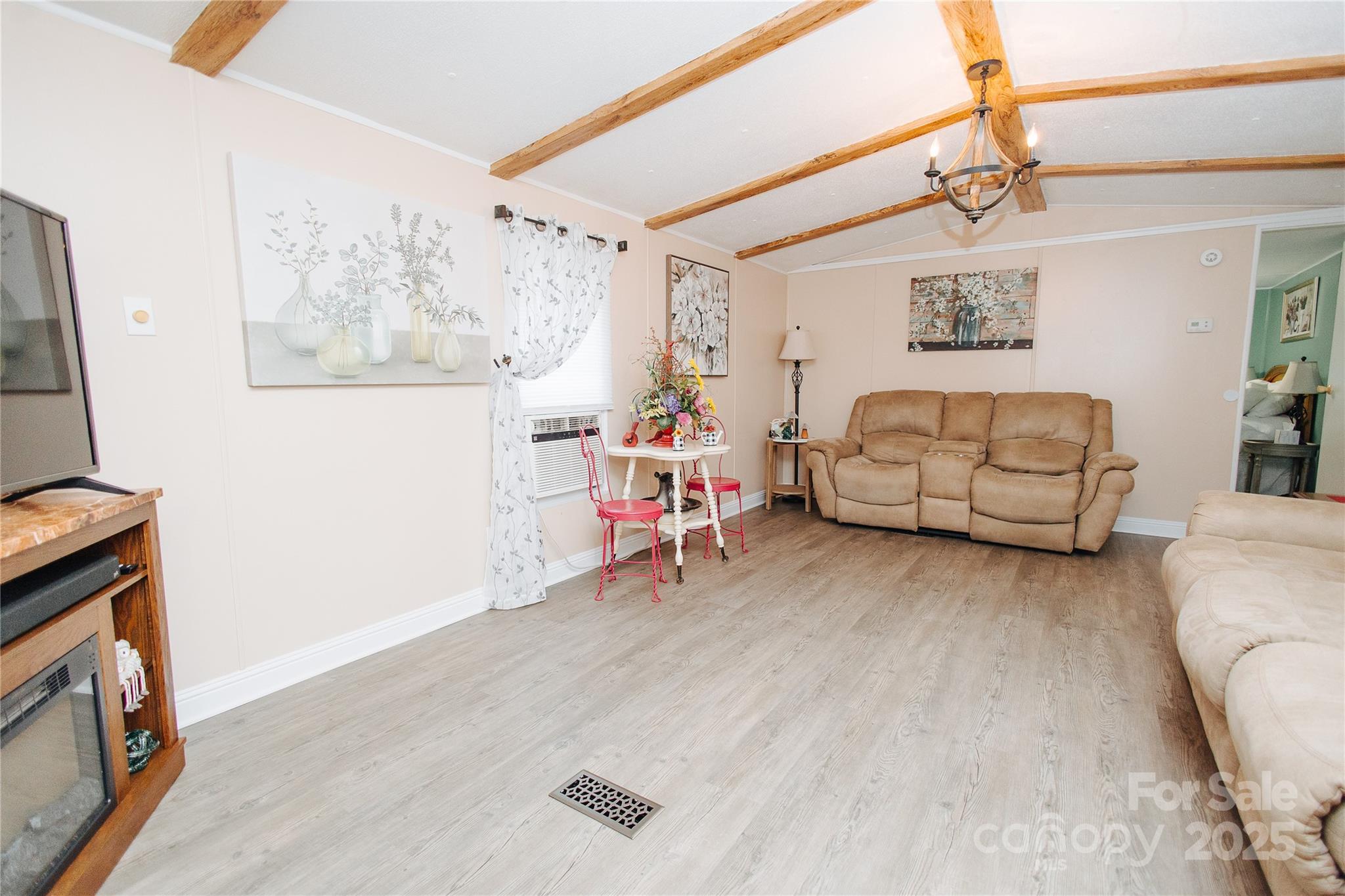 325 Griggs Road Old Fort, NC 28762 - Photo 24 of 36 a living room with furniture and a flat screen tv