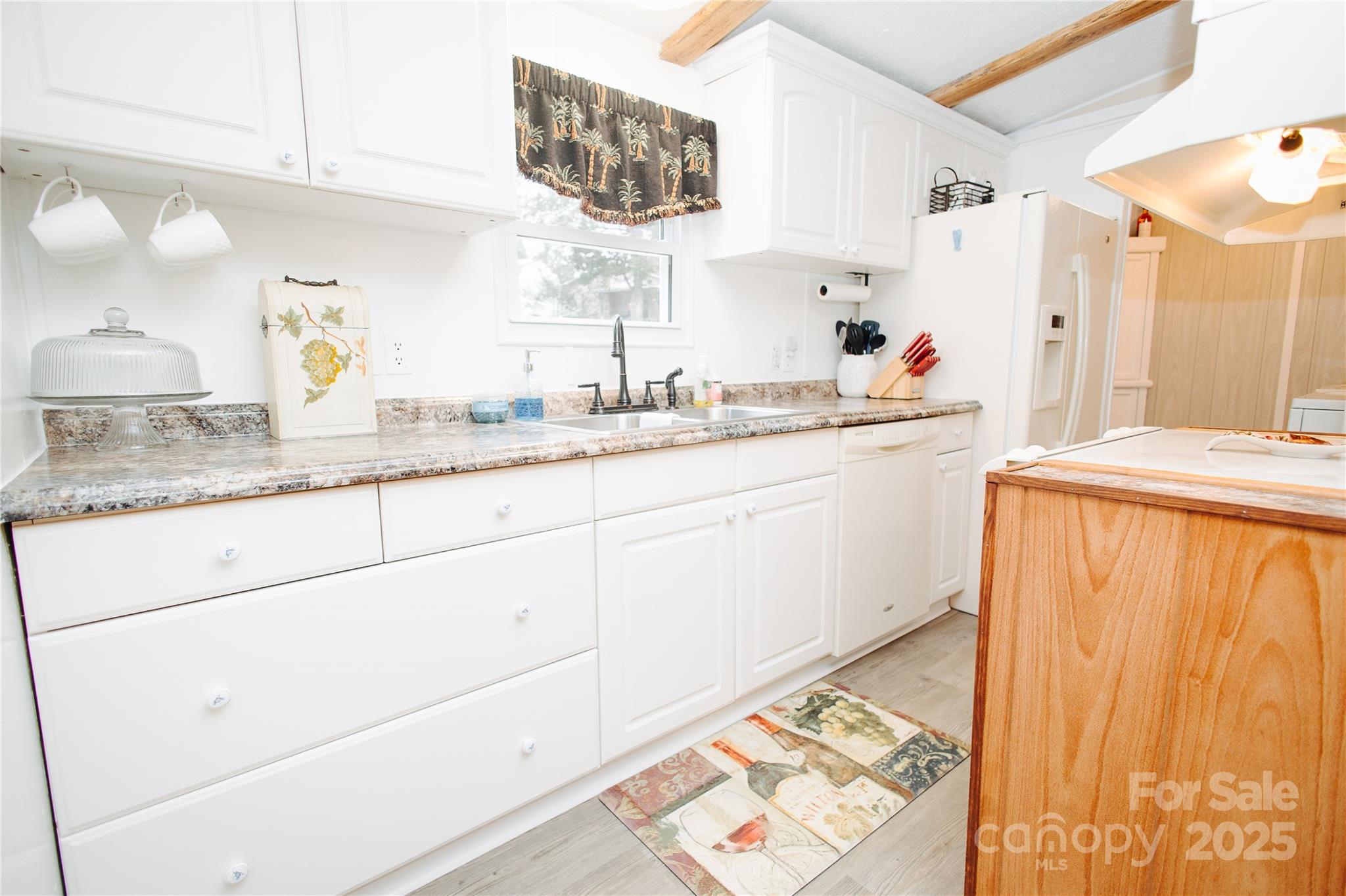 325 Griggs Road Old Fort, NC 28762 - Photo 27 of 36 a bathroom with a sink and a mirror