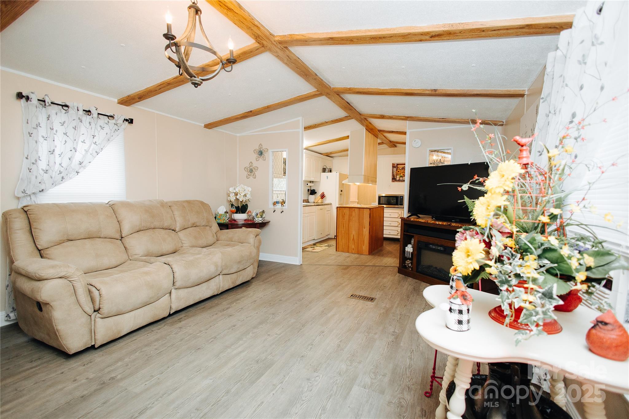 325 Griggs Road Old Fort, NC 28762 - Photo 32 of 36 a living room with furniture and a flat screen tv