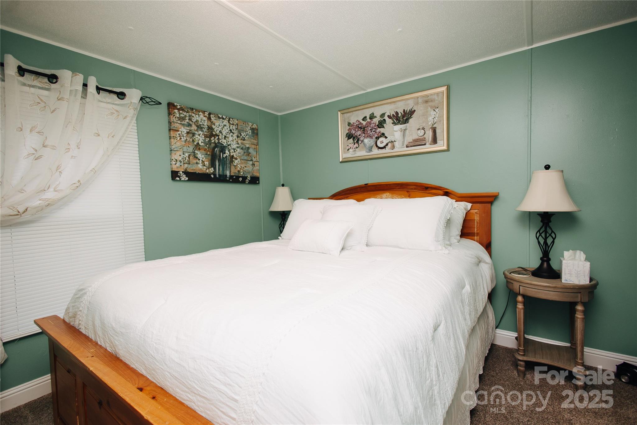 325 Griggs Road Old Fort, NC 28762 - Photo 35 of 36 a bedroom with a bed and a table in it