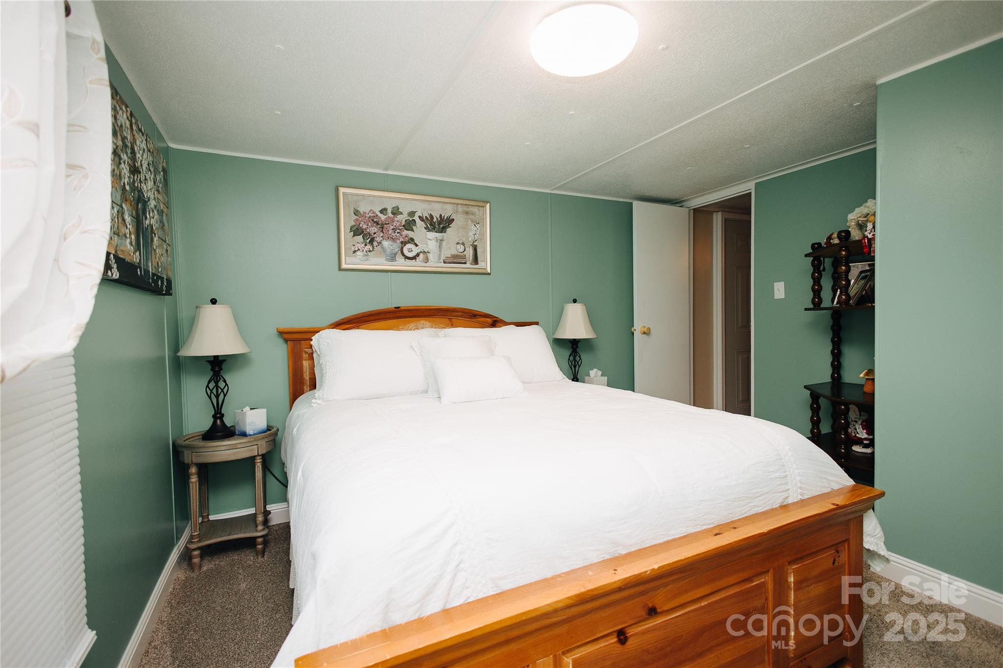325 Griggs Road Old Fort, NC 28762 - Photo 36 of 36 a bedroom with a bed and a dresser