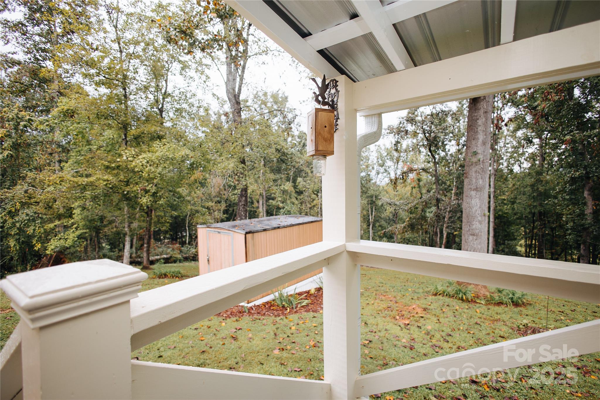 325 Griggs Road Old Fort, NC 28762 - Photo 9 of 36 a view of a balcony with wooden floor and fence
