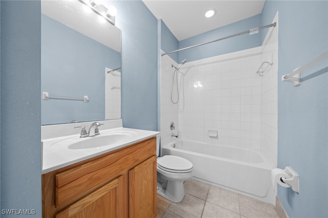 3844 Cherrybrook Loop Fort Myers, FL 33966 - Photo 18 of 29 a bathroom with a sink a toilet and shower