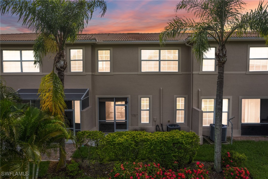 3844 Cherrybrook Loop Fort Myers, FL 33966 - Photo 24 of 29 a front view of a house with a garden
