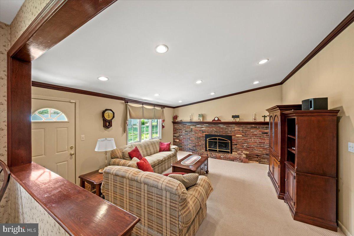 5 Everington Road Marlton, NJ 08053 - Photo 20 of 45 a living room with furniture a fireplace and a flat screen tv