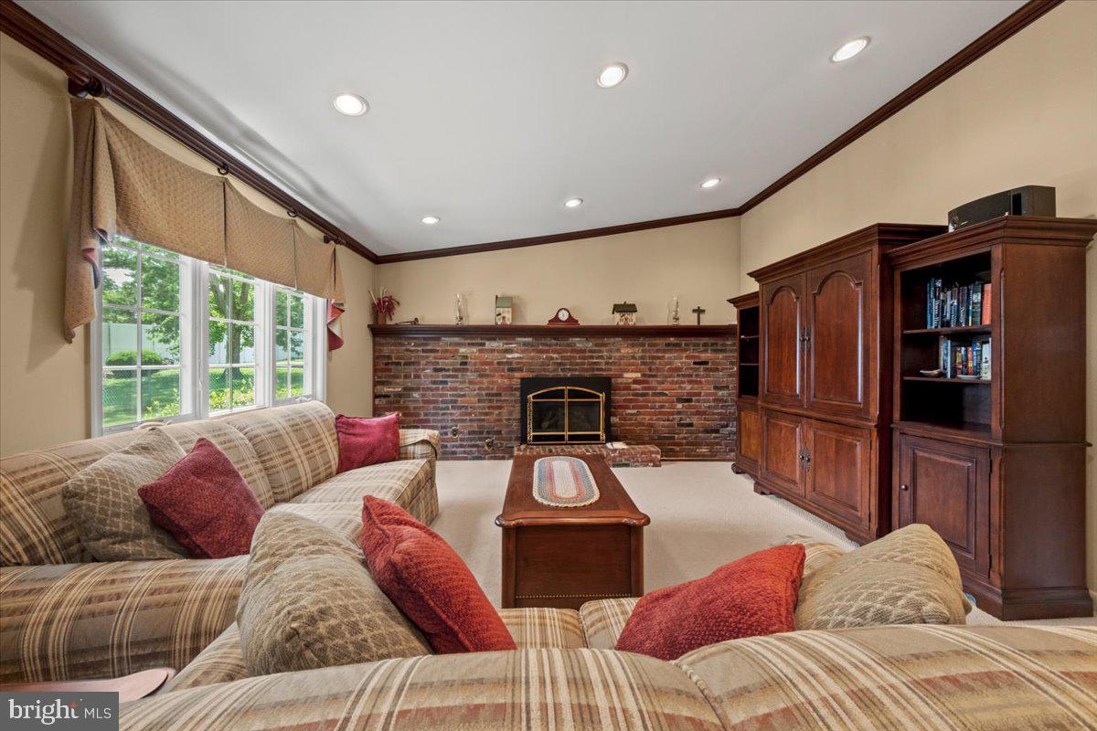 5 Everington Road Marlton, NJ 08053 - Photo 24 of 45 a living room with furniture a flat screen tv and a fireplace