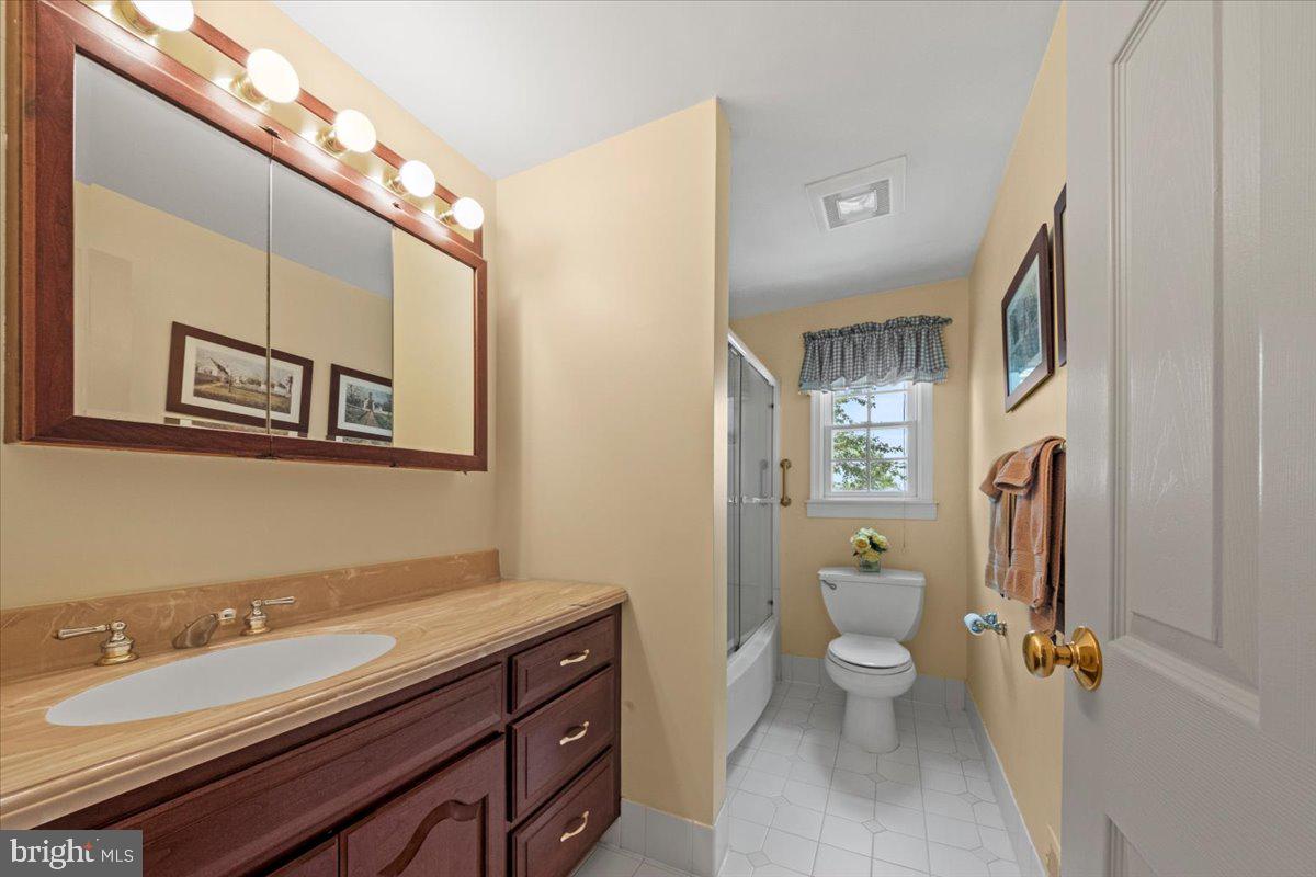 5 Everington Road Marlton, NJ 08053 - Photo 29 of 45 a bathroom with a granite countertop double vanity sink a mirror and a toilet