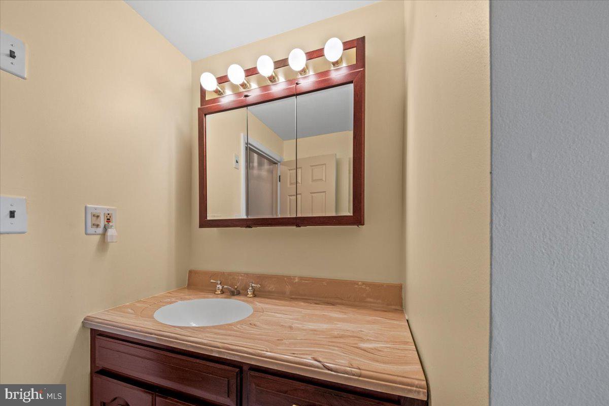 5 Everington Road Marlton, NJ 08053 - Photo 30 of 45 a bathroom with a sink and a mirror