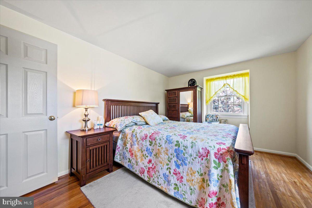 5 Everington Road Marlton, NJ 08053 - Photo 36 of 45 a bedroom with a bed and wooden floor