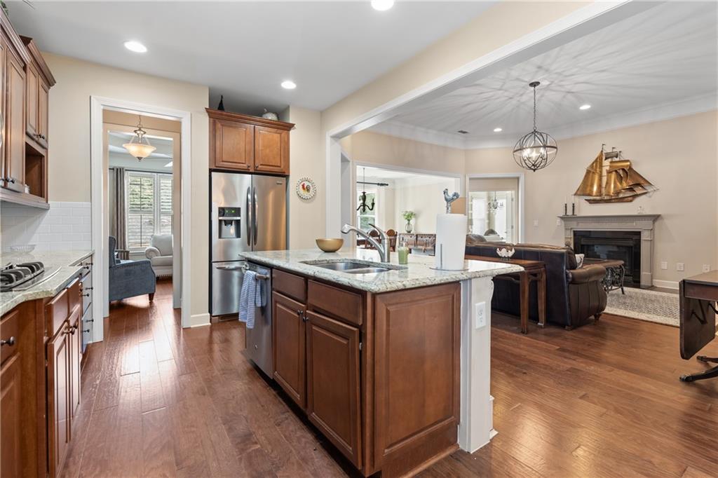 3457 Locust Cove Road Gainesville, GA 30504 - Photo 14 of 54 a kitchen with sink cabinets and wooden floor