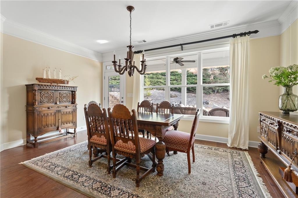 3457 Locust Cove Road Gainesville, GA 30504 - Photo 18 of 54 a view of a dining room with furniture window and wooden floor