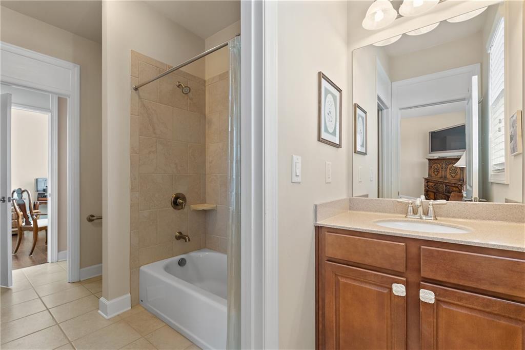 3457 Locust Cove Road Gainesville, GA 30504 - Photo 27 of 54 a bathroom with a tub sink and mirror