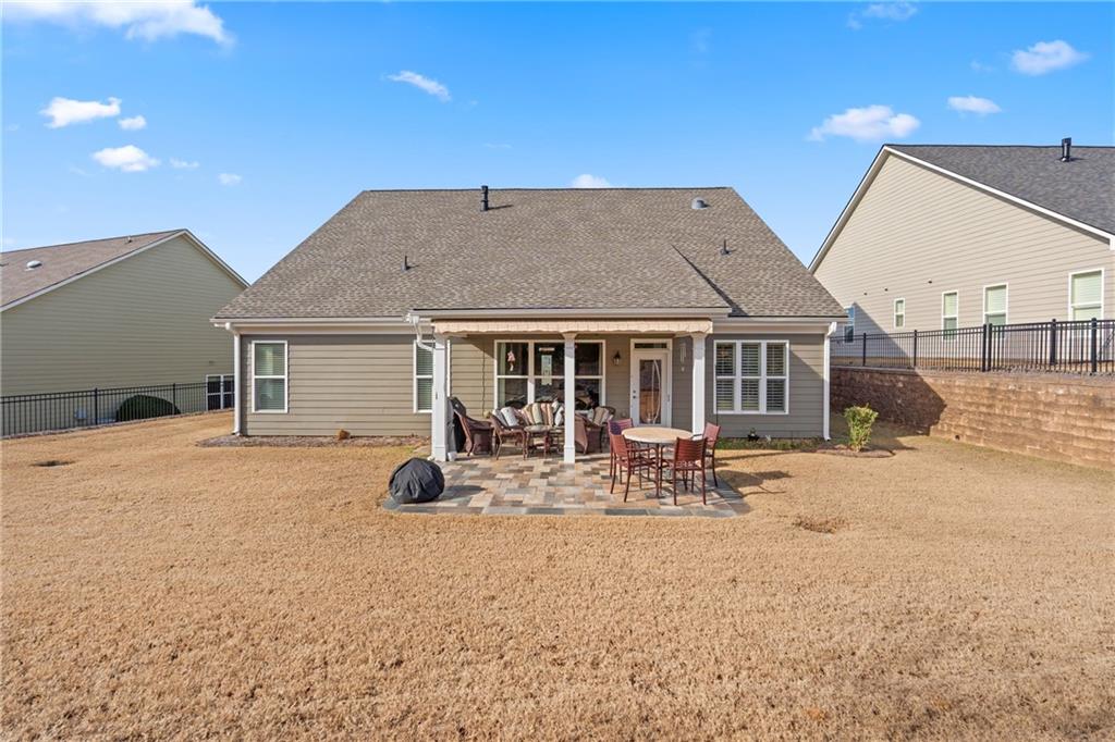 3457 Locust Cove Road Gainesville, GA 30504 - Photo 38 of 54 a backyard of a house with table and chairs