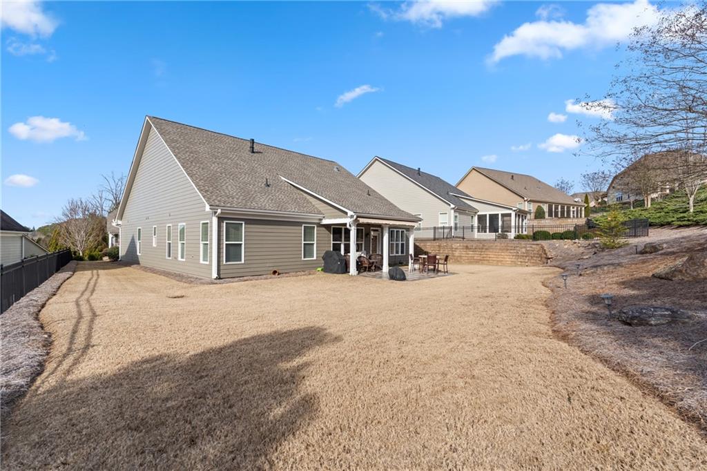 3457 Locust Cove Road Gainesville, GA 30504 - Photo 40 of 54 a view of a house with a yard