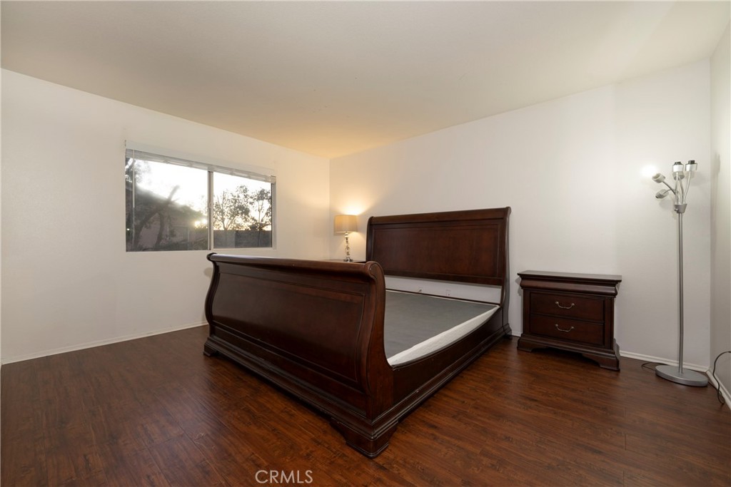 6319 Lavender Street Eastvale, CA 92880 - Photo 23 of 39 a bedroom with a bed and window