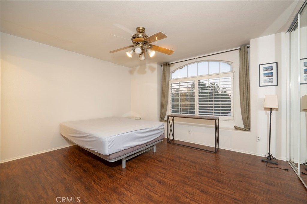 6319 Lavender Street Eastvale, CA 92880 - Photo 30 of 39 a bedroom with a bed and a window