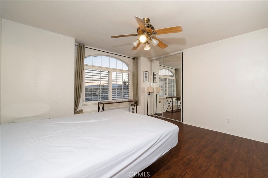 6319 Lavender Street Eastvale, CA 92880 - Photo 31 of 39 a bedroom with a large bed and a window