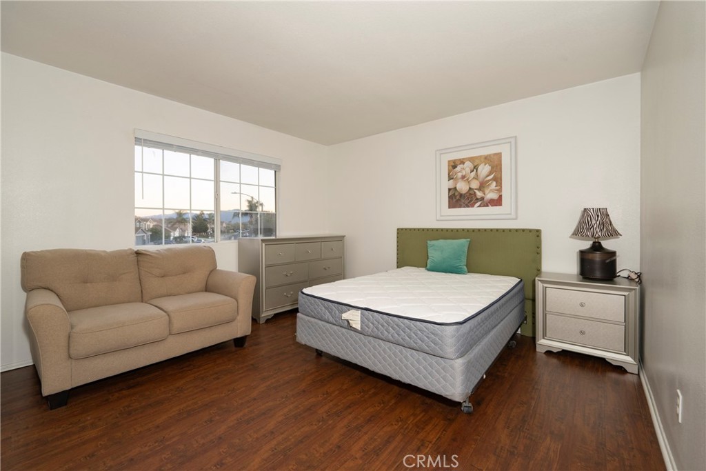 6319 Lavender Street Eastvale, CA 92880 - Photo 33 of 39 a bedroom with a bed and a couch
