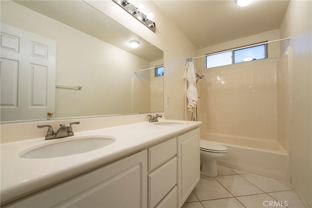 6319 Lavender Street Eastvale, CA 92880 - Photo 34 of 39 a bathroom with a sink a toilet and shower
