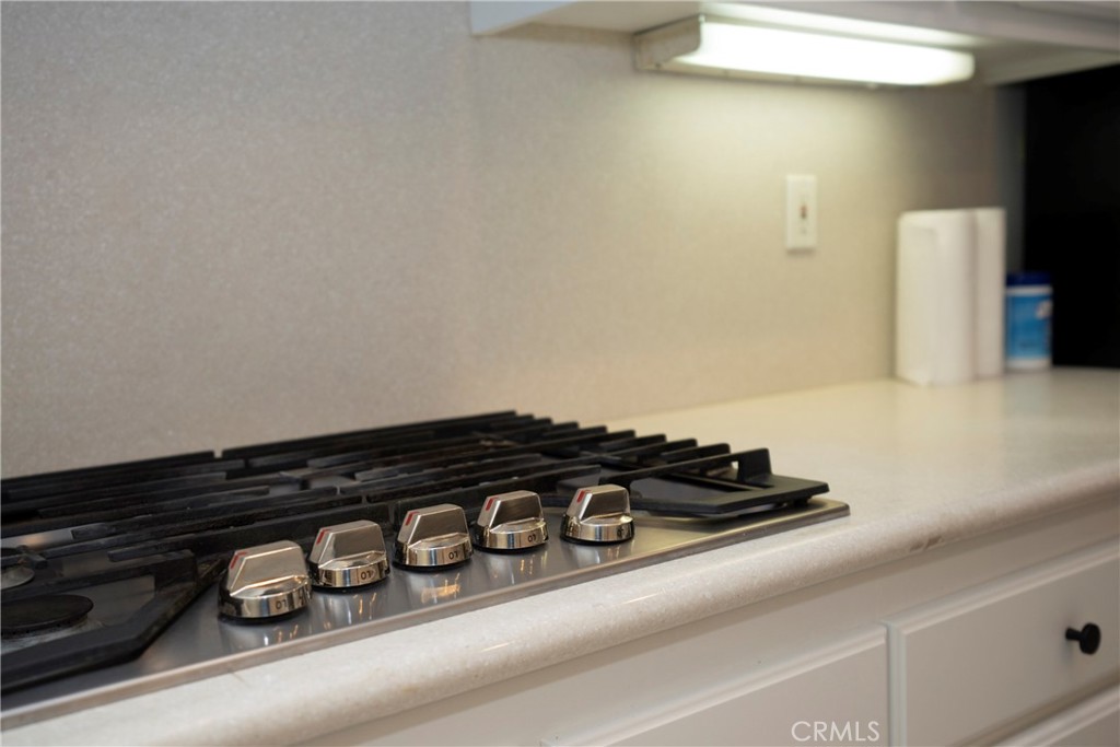 6319 Lavender Street Eastvale, CA 92880 - Photo 9 of 39 a close up of a stove top oven sitting on a counter