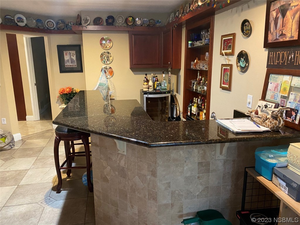 32 Winchester Road Ormond Beach, FL 32174 - Photo 26 of 84 a kitchen with a sink and cabinets