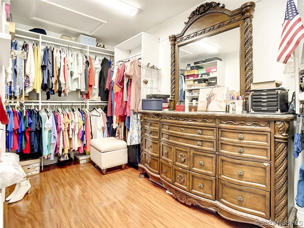 32 Winchester Road Ormond Beach, FL 32174 - Photo 43 of 84 a view of walk in closet with clothes and shoes