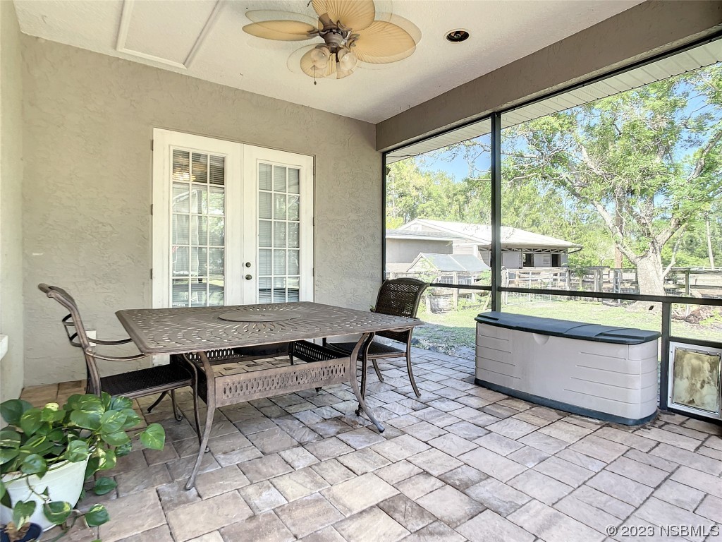 32 Winchester Road Ormond Beach, FL 32174 - Photo 58 of 84 a living room with furniture and a large window
