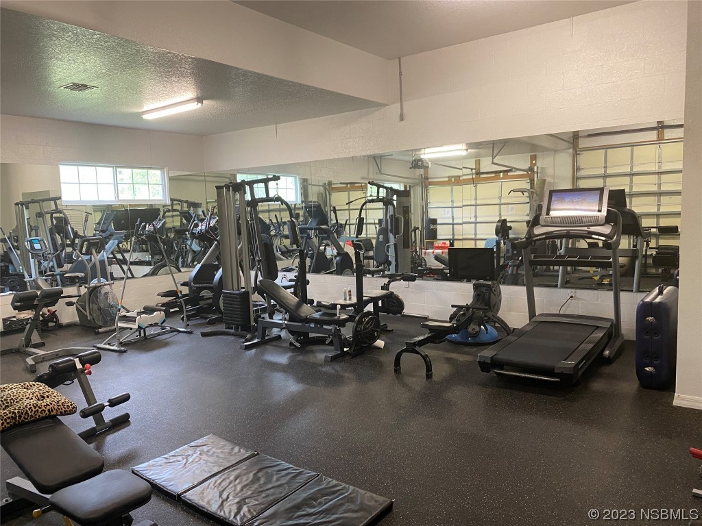 32 Winchester Road Ormond Beach, FL 32174 - Photo 61 of 84 a view of a room with gym equipment