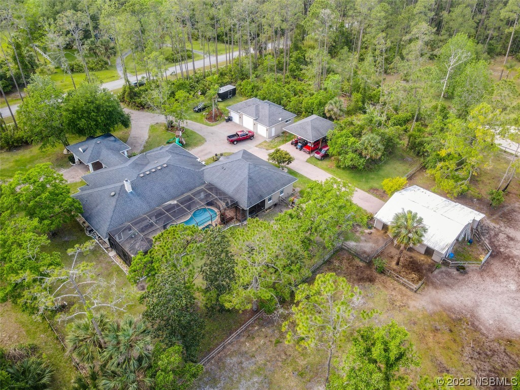 32 Winchester Road Ormond Beach, FL 32174 - Photo 65 of 84 an aerial view of a house with a yard