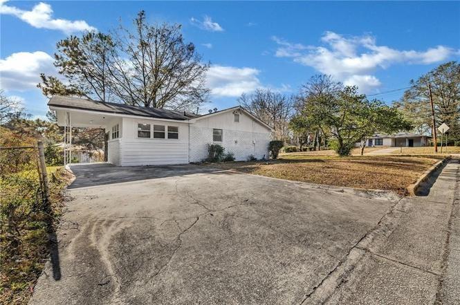 2356 County Line Road Southwest Atlanta, GA 30331 - Photo 2 of 8 a view of a house with a yard