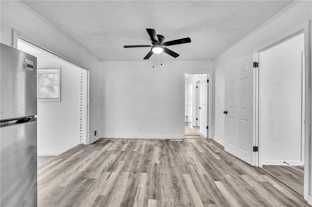 2356 County Line Road Southwest Atlanta, GA 30331 - Photo 3 of 8 a view of empty room with wooden floor and ceiling fan