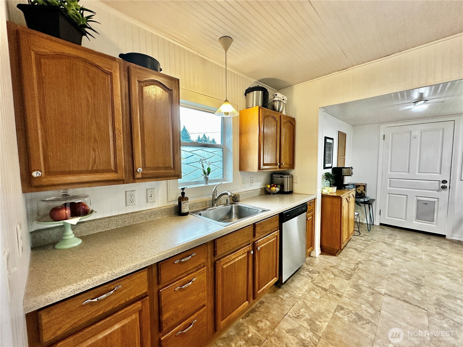 303 South Buckner Street Centralia, WA 98531 - Photo 13 of 33 a kitchen with a sink cabinets and window