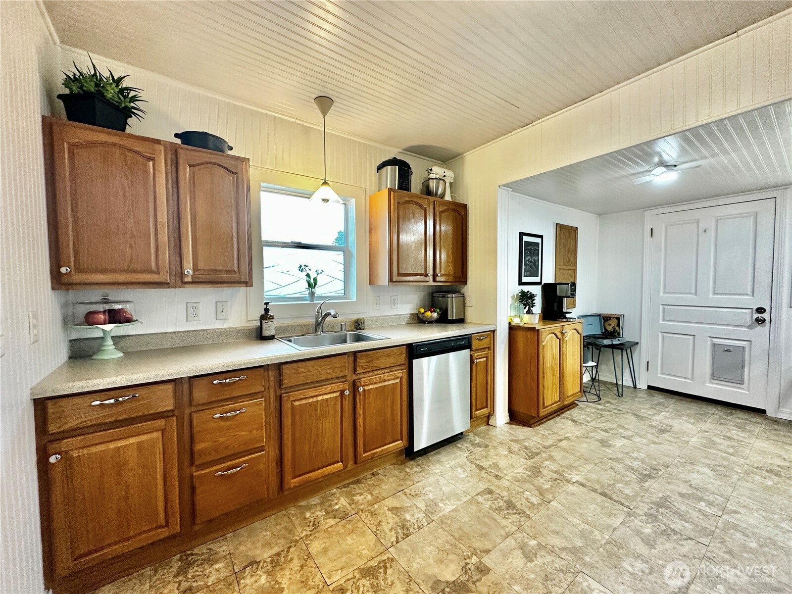 303 South Buckner Street Centralia, WA 98531 - Photo 15 of 33 a large kitchen with stainless steel appliances granite countertop a sink and cabinets