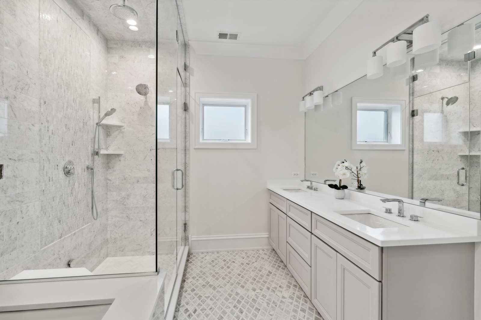 1511 West Byron Street, Unit 2 Chicago, IL 60613 - Photo 13 of 21 a bathroom with a double vanity sink mirror and shower