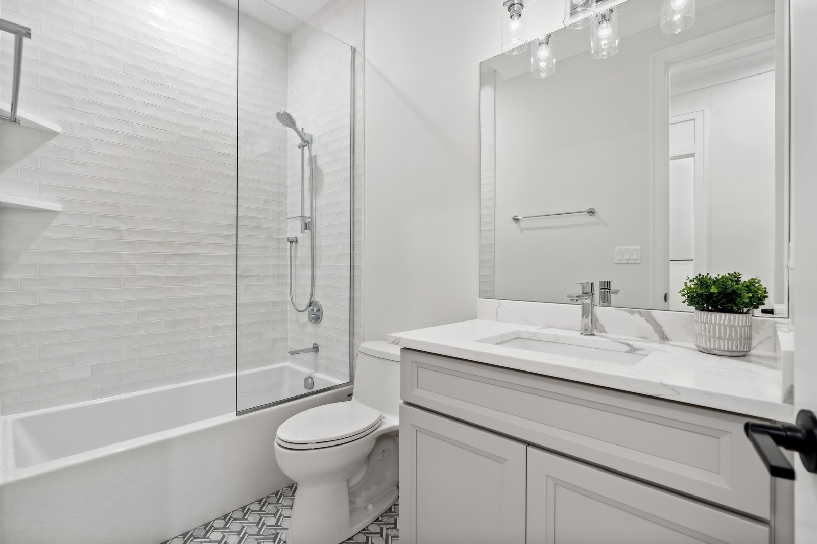 1511 West Byron Street, Unit 2 Chicago, IL 60613 - Photo 16 of 21 a bathroom with a sink a toilet and a mirror