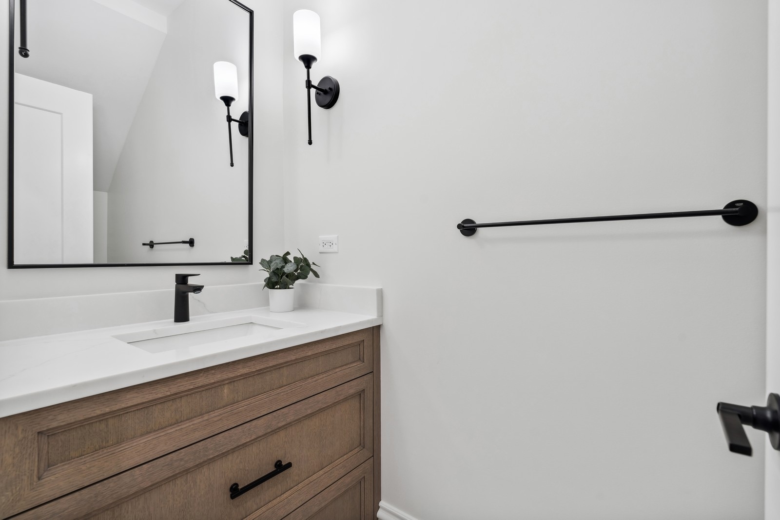 1511 West Byron Street, Unit 2 Chicago, IL 60613 - Photo 17 of 21 a bathroom with a sink and a mirror