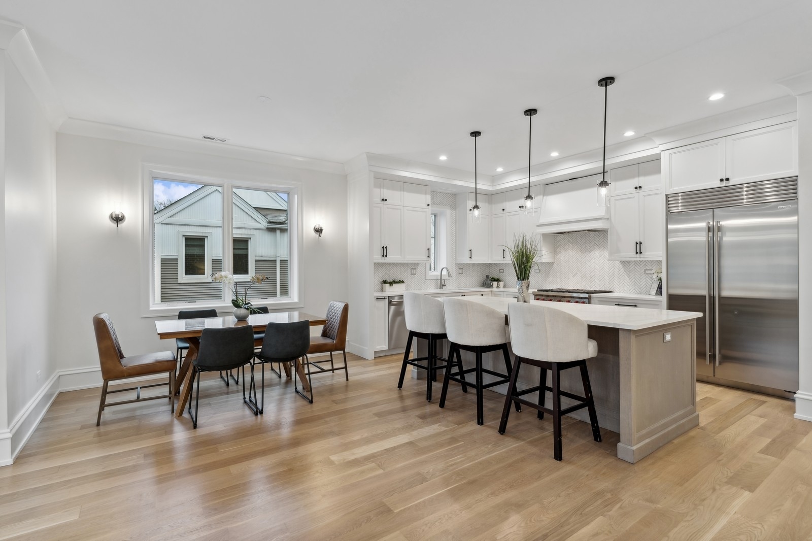 1511 West Byron Street, Unit 2 Chicago, IL 60613 - Photo 7 of 21 a large kitchen with a table and chairs