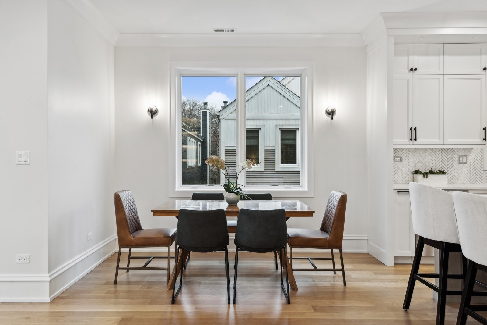 1511 West Byron Street, Unit 2 Chicago, IL 60613 - Photo 10 of 21 a view of a dining room with furniture and wooden floor