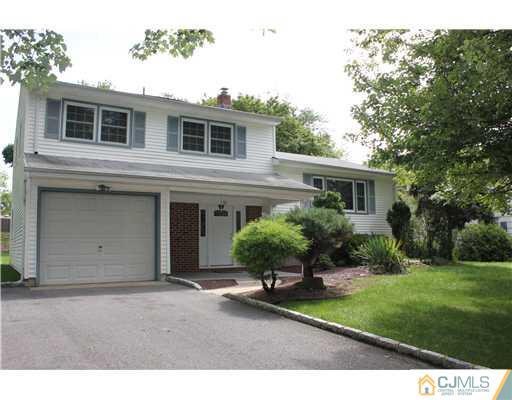 10 Butler Road Edison, NJ 08820 - Photo 1 of 13 a house view with a garden space