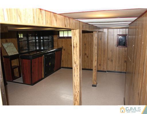 10 Butler Road Edison, NJ 08820 - Photo 11 of 13 a kitchen with refrigerator and cabinets