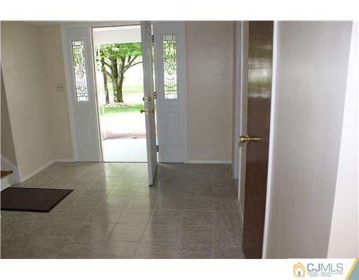 10 Butler Road Edison, NJ 08820 - Photo 3 of 13 a view of an empty room with a window