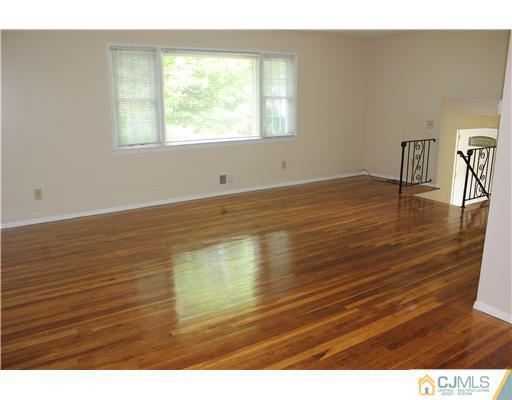 10 Butler Road Edison, NJ 08820 - Photo 5 of 13 a view of room and wooden floor