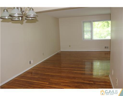 10 Butler Road Edison, NJ 08820 - Photo 6 of 13 a view of a room with wooden floor